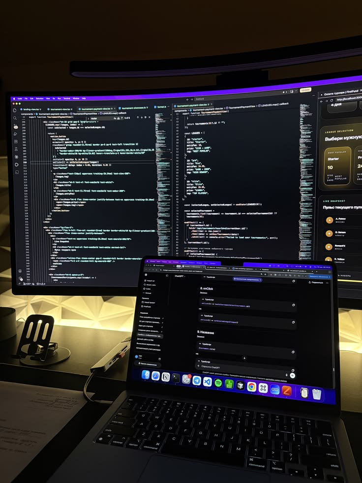 Development setup with code and a dashboard on two screens
